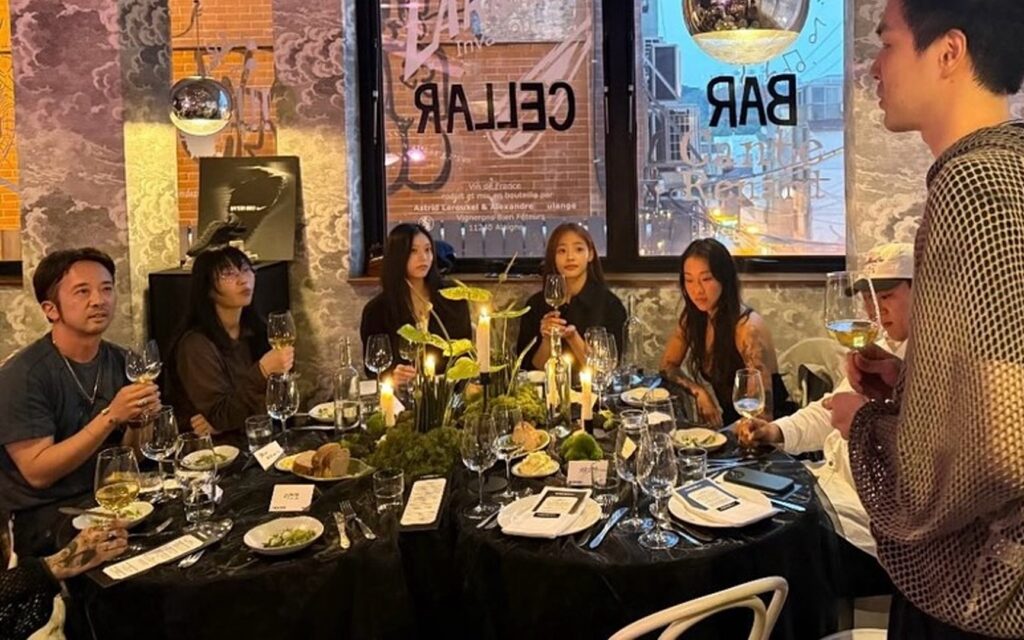 Photo of newjeans at dinner with wine glasses sparks heated